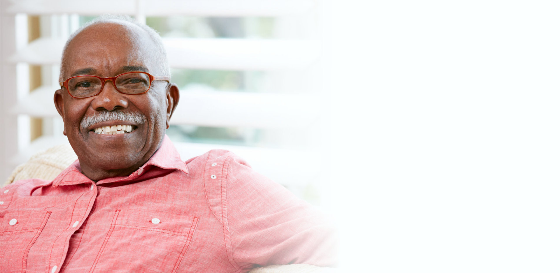 Portrait Of Happy Senior Man At Home