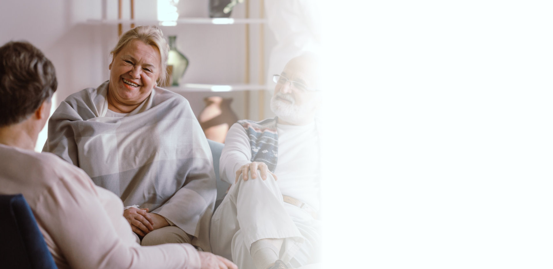 Smiling elderly people talking together in nursing home