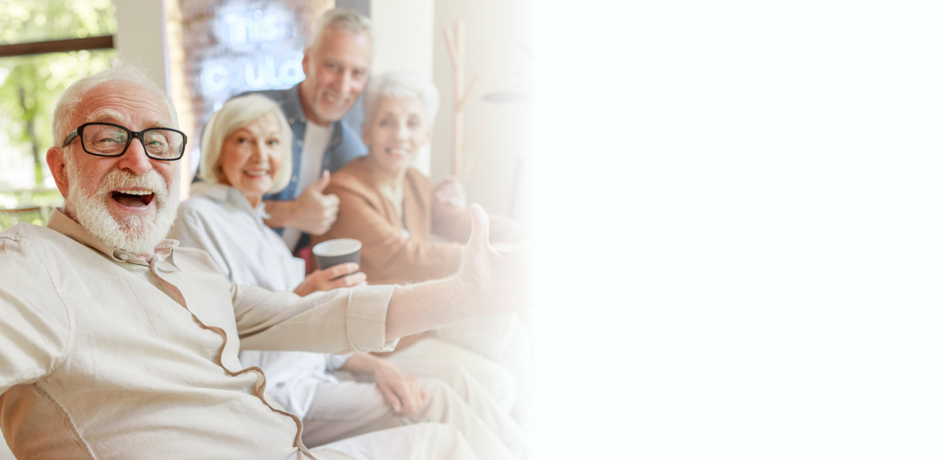 Joyful senior man spending time with friends stock photo