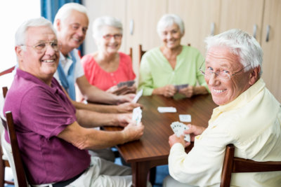 woman and elderly woman playing a puzzle